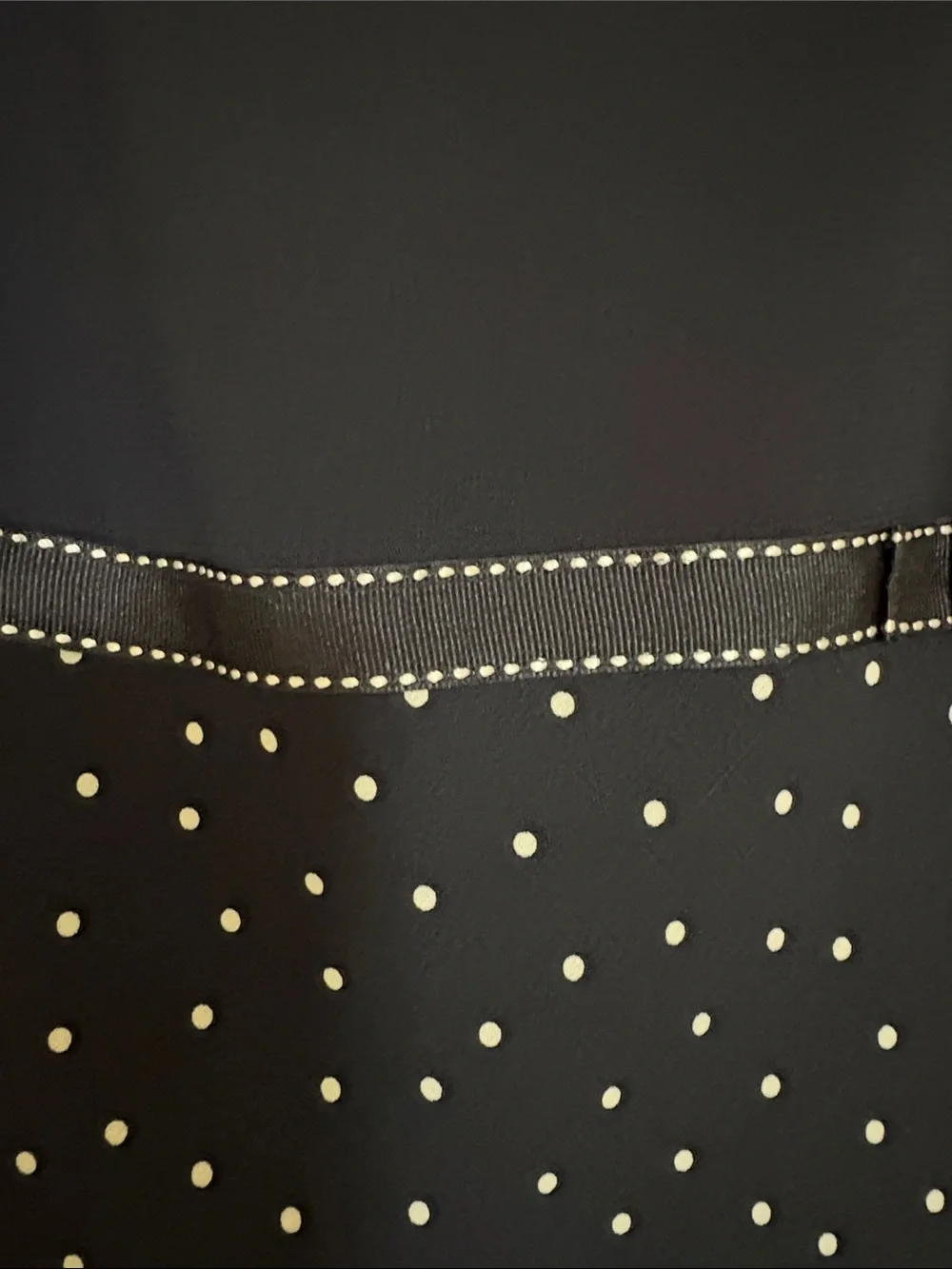 Casual Corner Annex Petite ivory label on black fabric